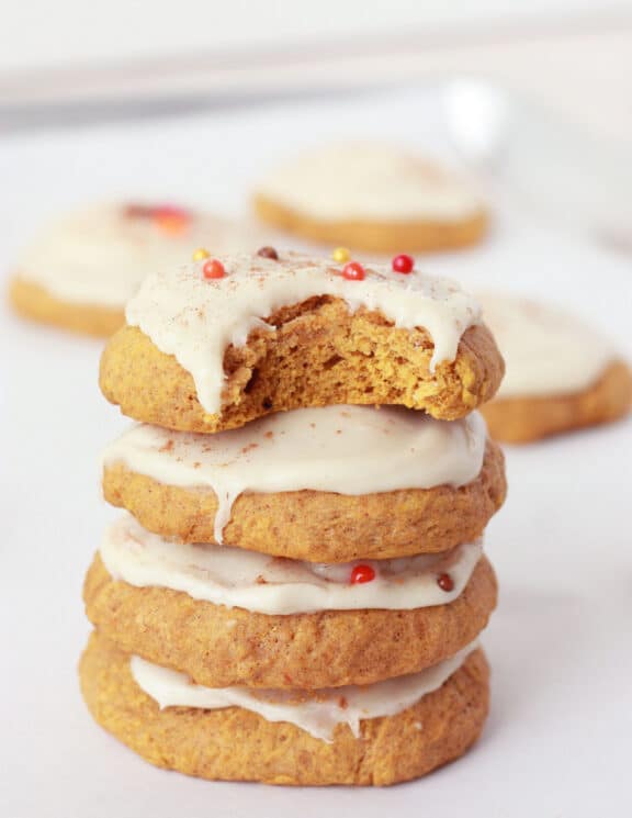 soft pumpkin cookie stack with maple frosting and fall sprinkles