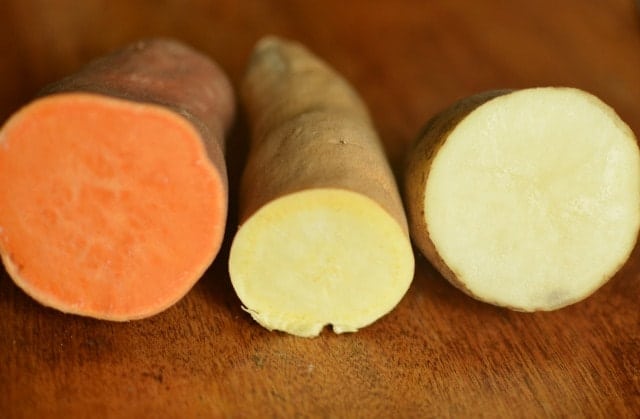 yam, sweet potato, and russet potato cut so that you can see the inside
